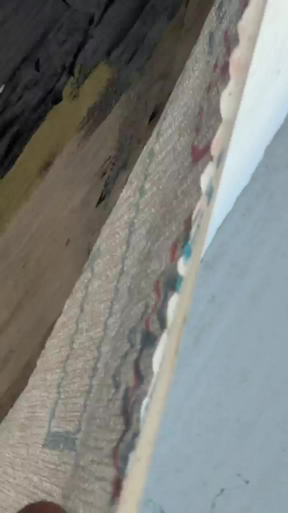 The failed glue line, lifted by hand; water was collecting behind it