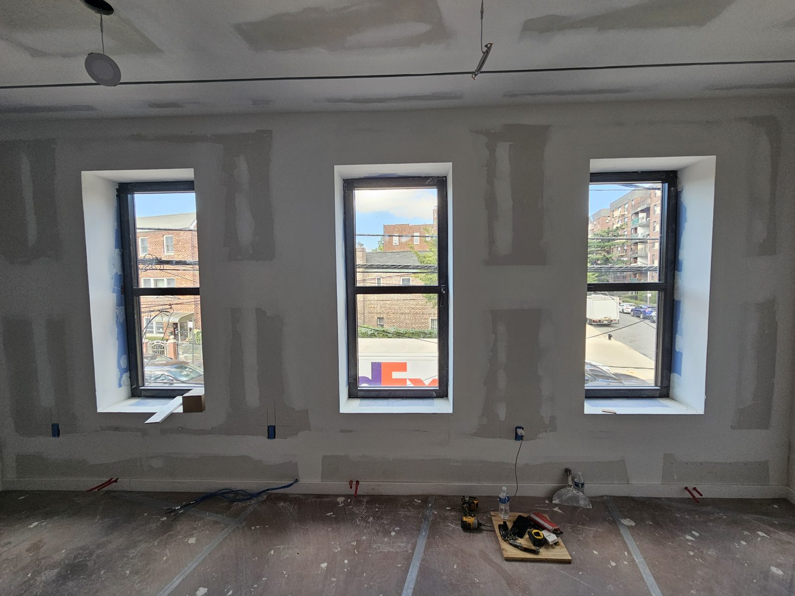 Three front Cortizo tilt-and-turn windows with a horizontal bar to match a double-hung look, Gravesend Brooklyn