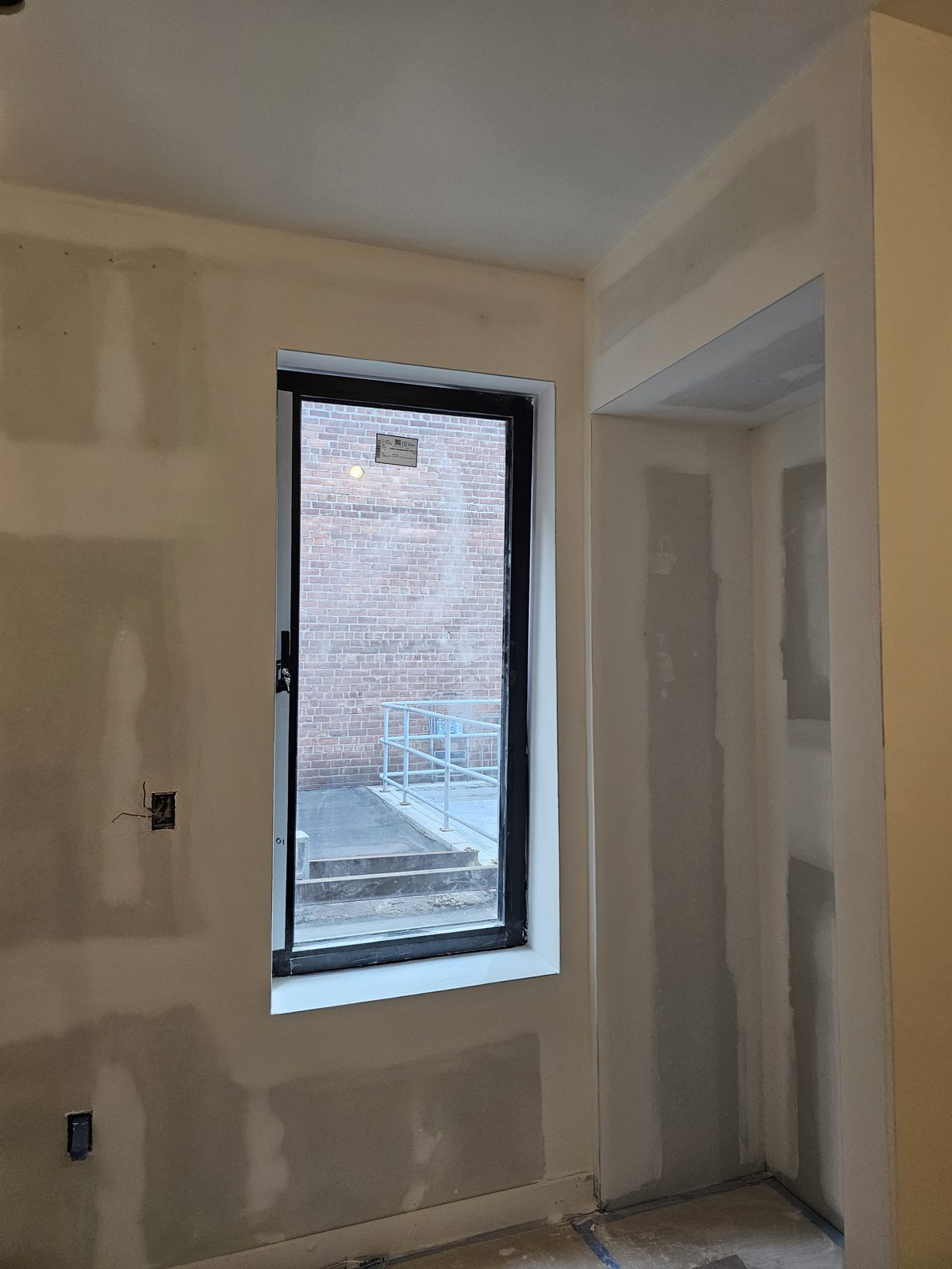 Rear full-view black aluminum window with key handle, Gravesend Neck Road