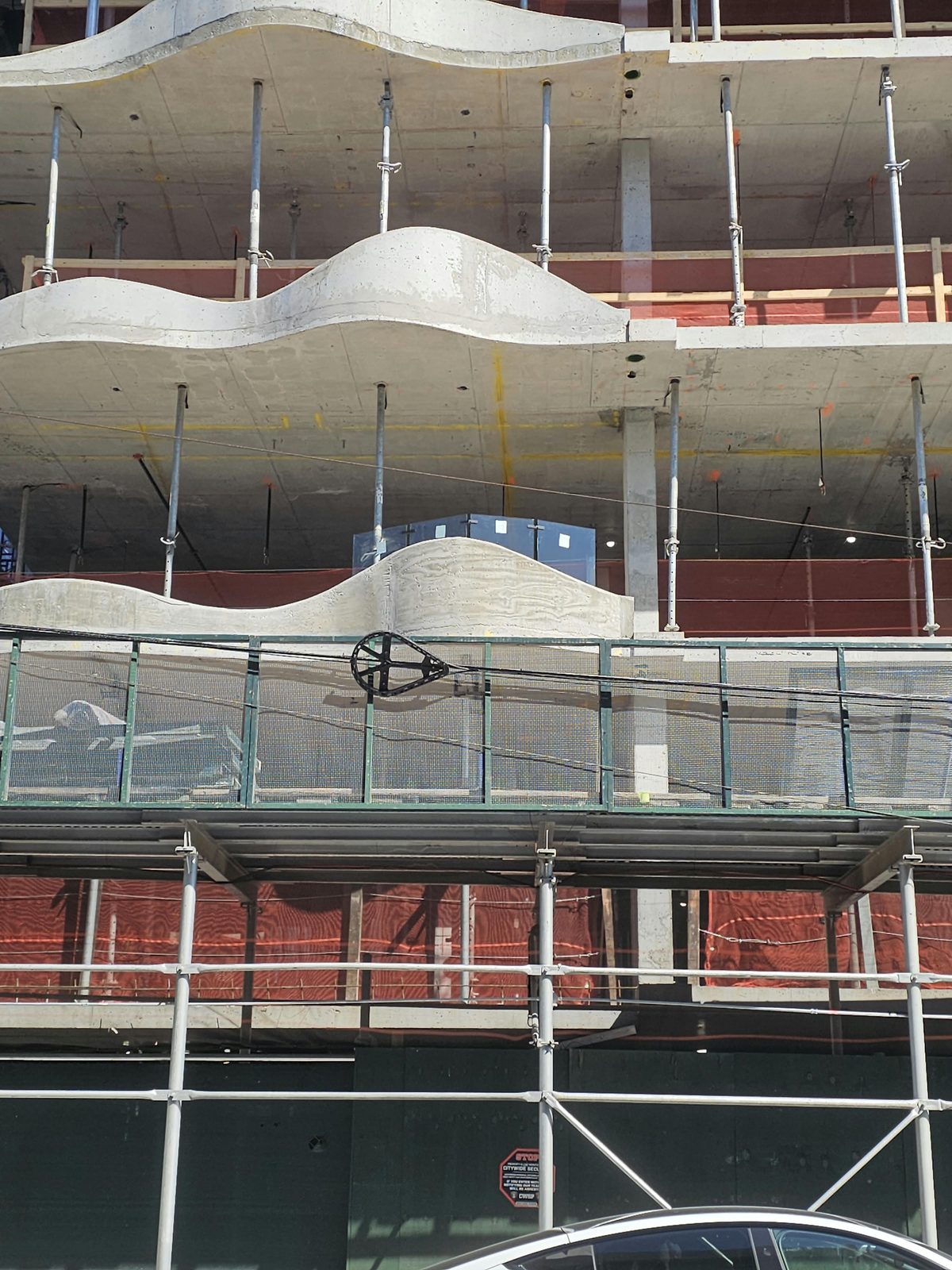 Three stacked wave-form balcony slabs at 1505 Emmons Avenue, Sheepshead Bay
