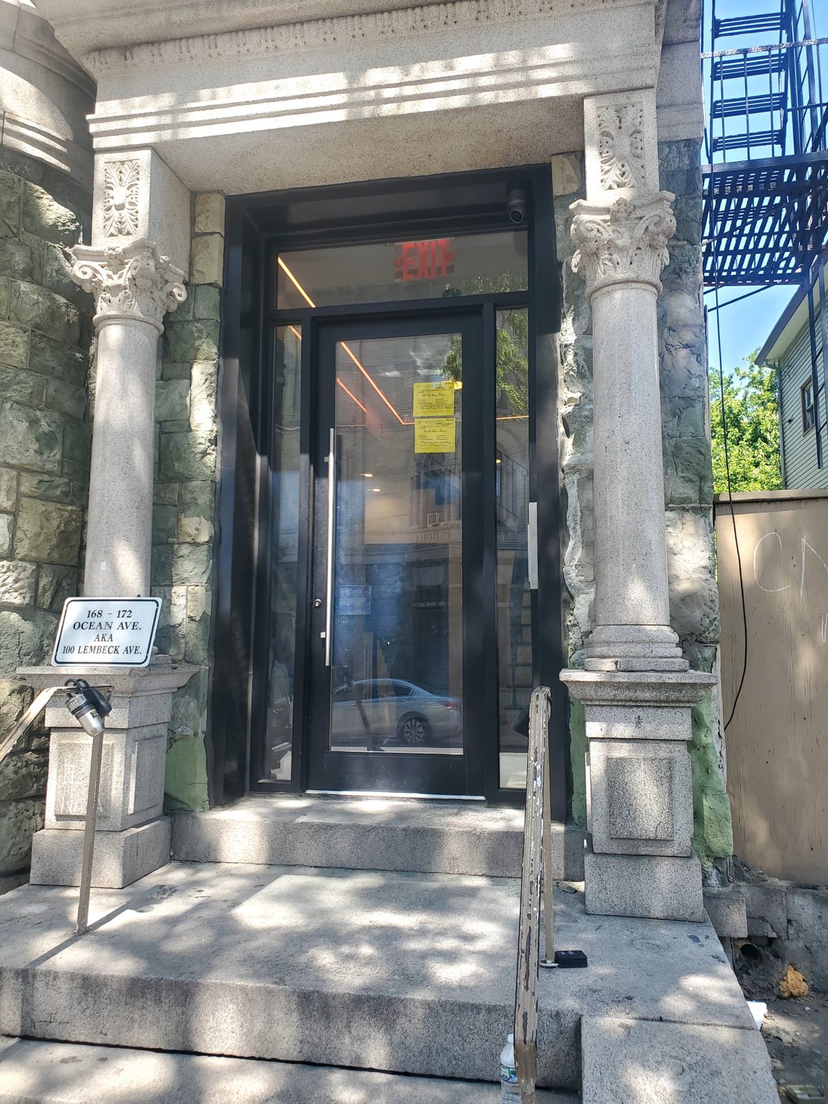 Residential building entrance replacement seen from the steps at 168-172 Ocean Avenue, Jersey City NJ