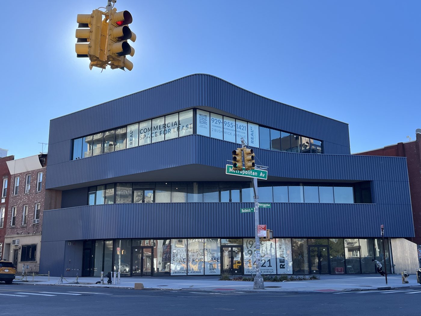 Ground-floor storefront with grand double-leaf entry doors at 2 Bushwick Avenue, Williamsburg
