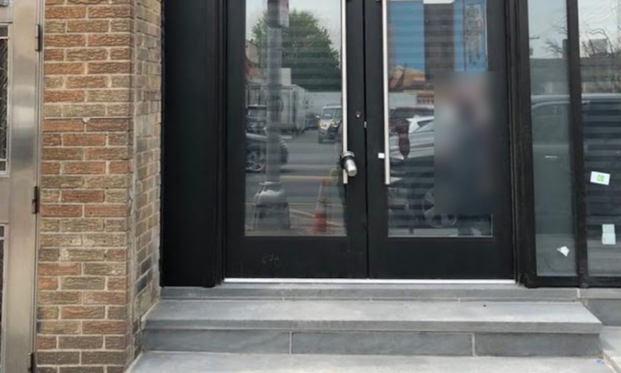 Pair of black medium-stile commercial aluminum entrance doors with hardware at 237 Central Avenue, Jersey City