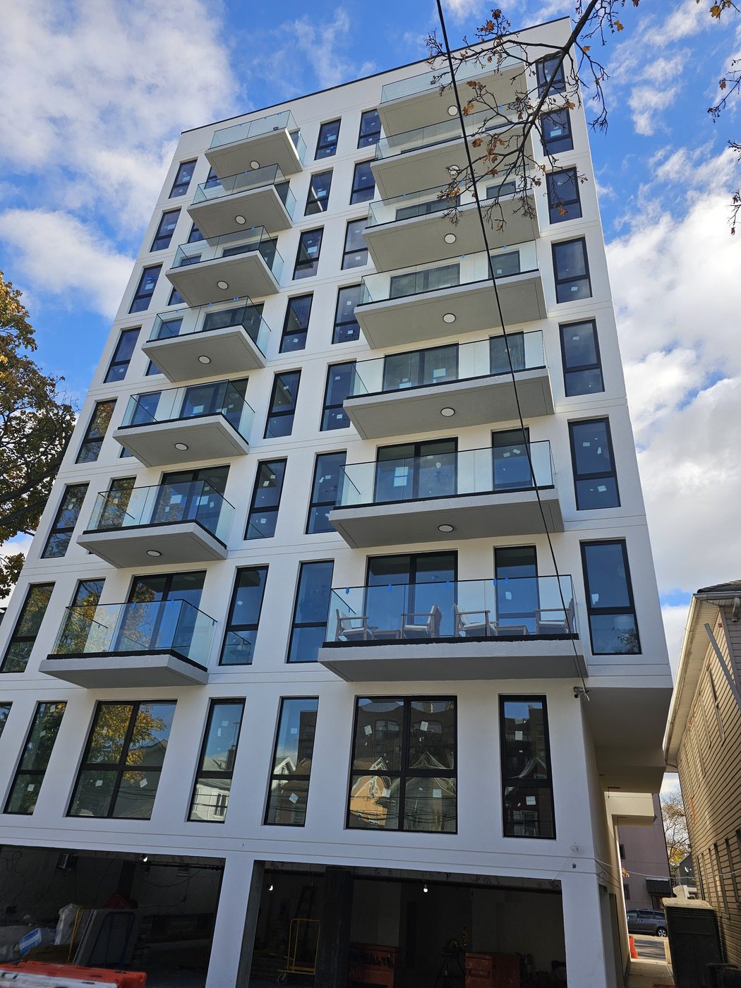 Full facade of 2518 Ocean Avenue, Brooklyn, with Everest aluminum windows and balcony doors across every floor