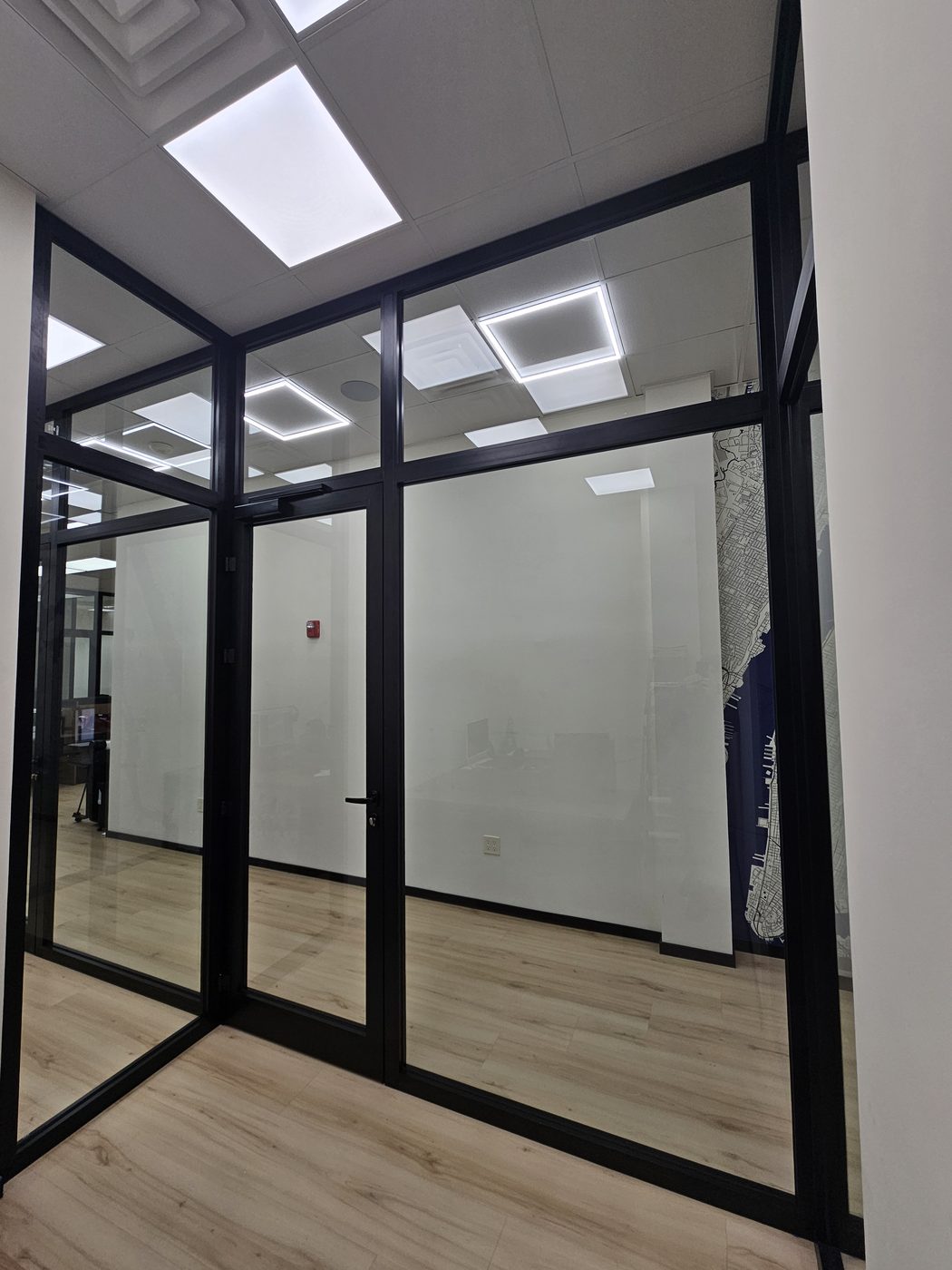 Corner office with full-height aluminum glass door and transom at 3121 Ocean Avenue, Sheepshead Bay