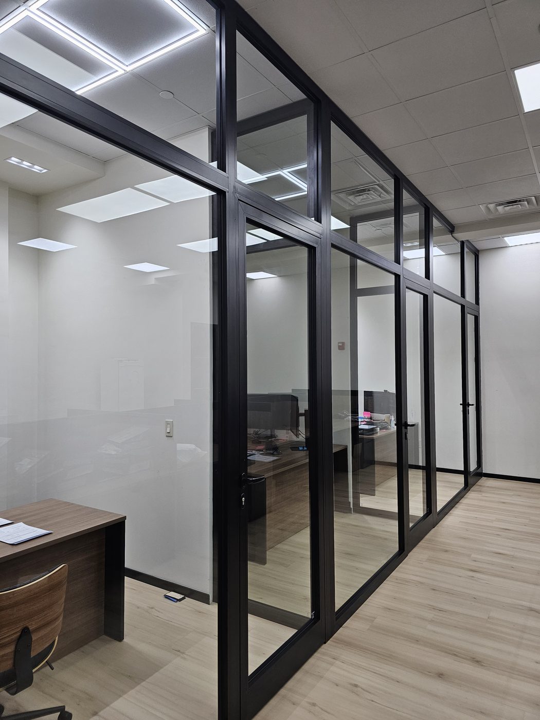 Private offices with full-height aluminum glass doors and lever handles at 3121 Ocean Avenue, Sheepshead Bay