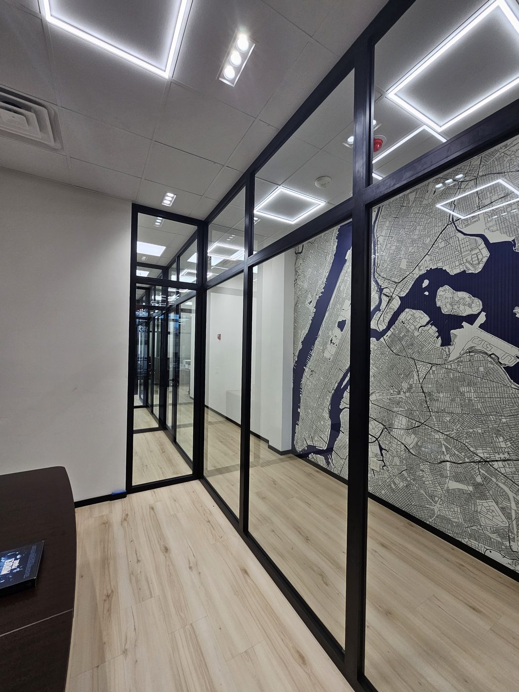 Large glass panels in slim black aluminum framing at 3121 Ocean Avenue, Sheepshead Bay
