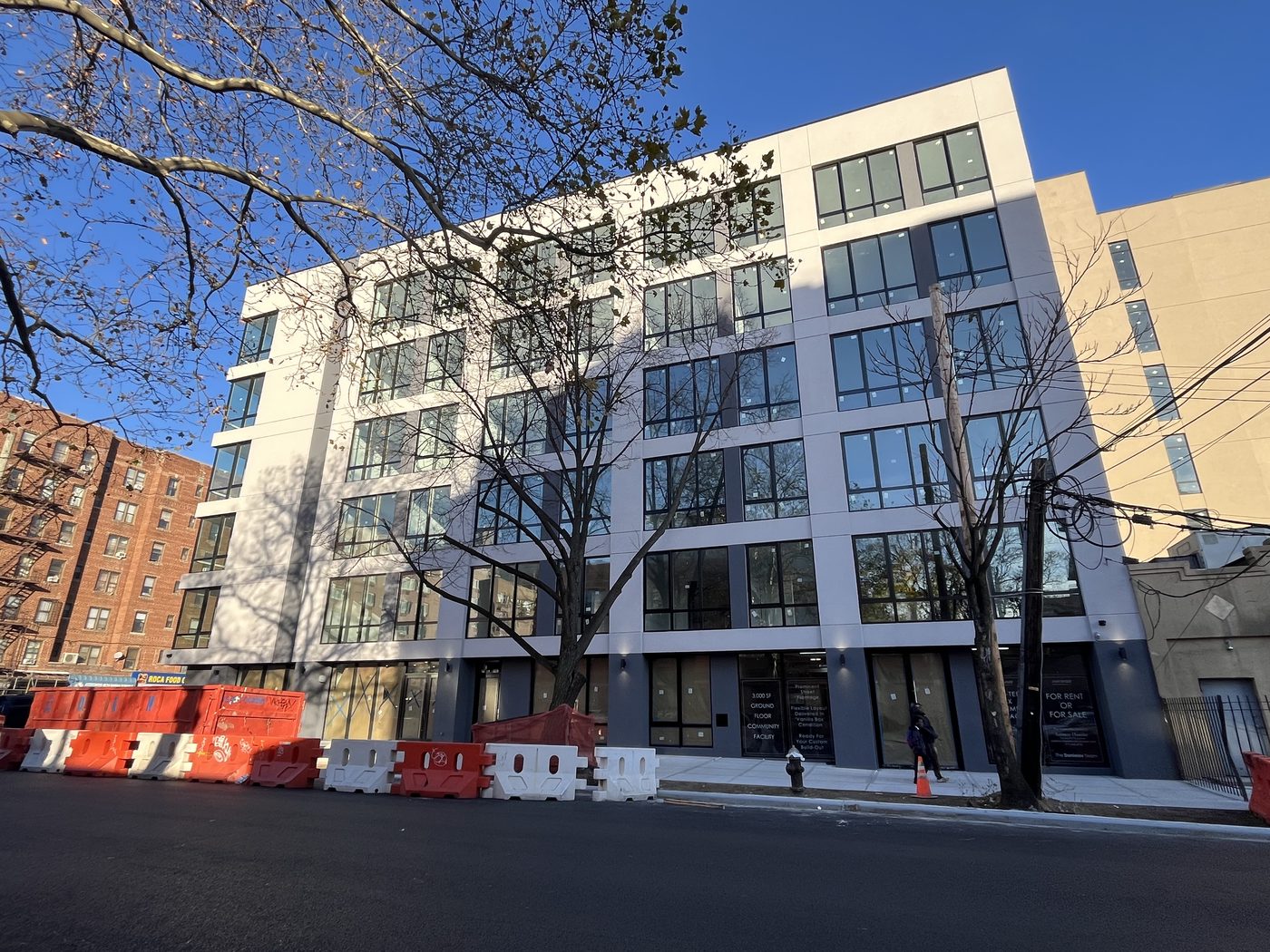 New York Avenue elevation of 408 Lefferts Avenue with ground-floor storefront for the community facility