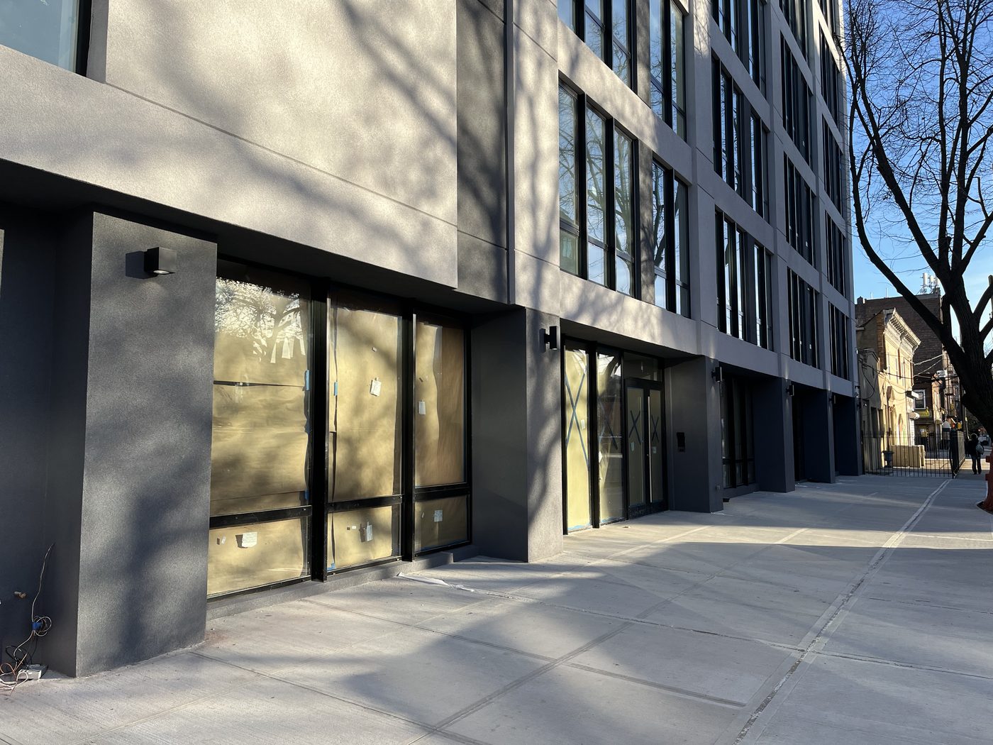 Looking up the corner of 408 Lefferts Avenue where the windows of two facades meet with no solid wall between them
