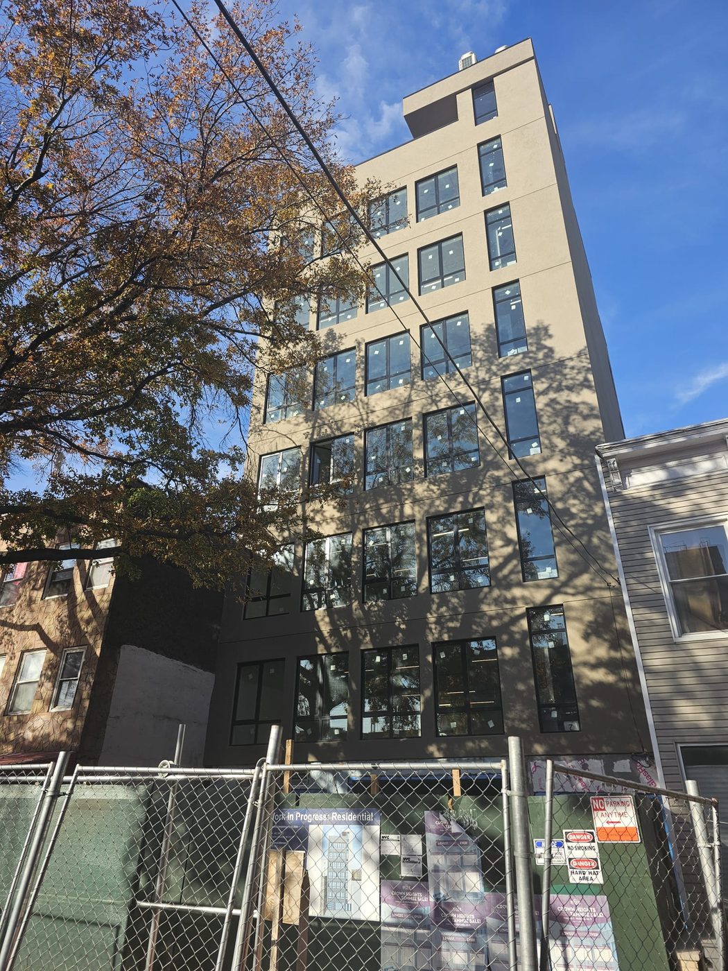 Building elevation during construction showing window installation, 461 East New York Avenue, Brooklyn