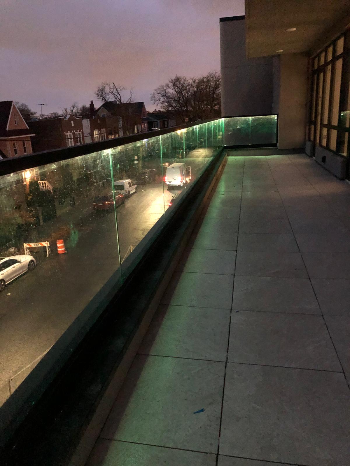Terrace with frameless glass railing at 61 Avenue U, Brooklyn