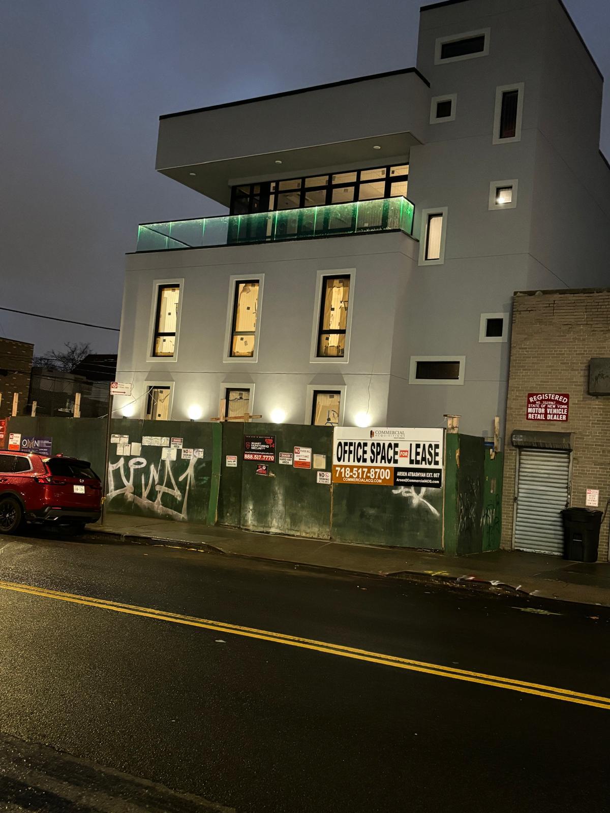 Glass railing with integrated LED lighting installed at 61 Avenue U, Brooklyn
