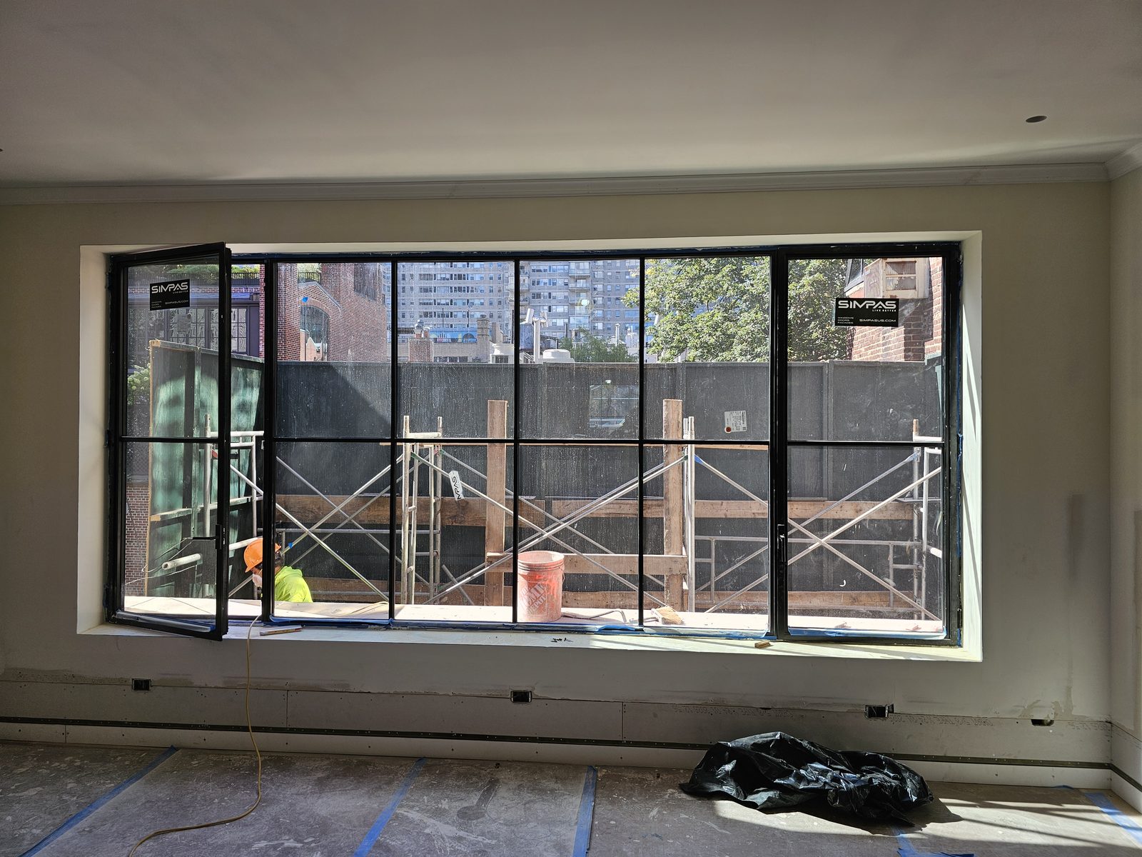 Black SIMPAS window wall with one casement open, East 70th Street Manhattan