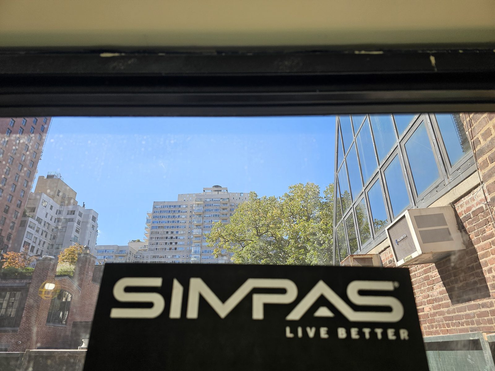 SIMPAS Live Better label on the glass of a newly installed unit
