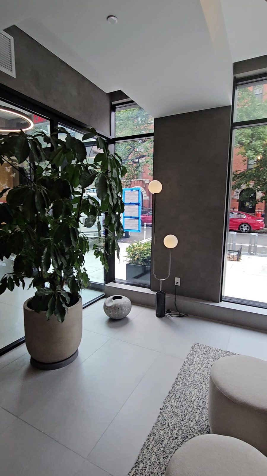Lobby of 711 Franklin Avenue showing the glass vestibule and the storefront glazing to the street