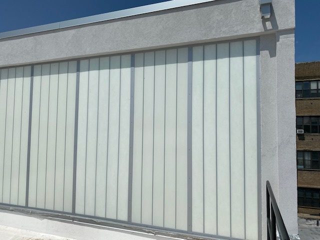 Closer view of the Kalwall translucent panel wall with aluminum battens at 96 Ingraham Street, Brooklyn