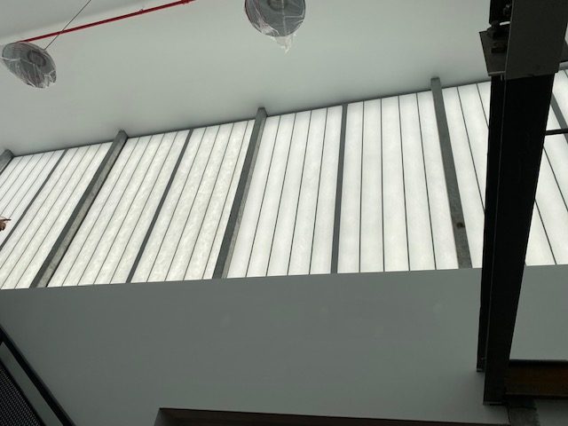 Interior view looking up at the Kalwall translucent panel wall at 96 Ingraham Street, Brooklyn
