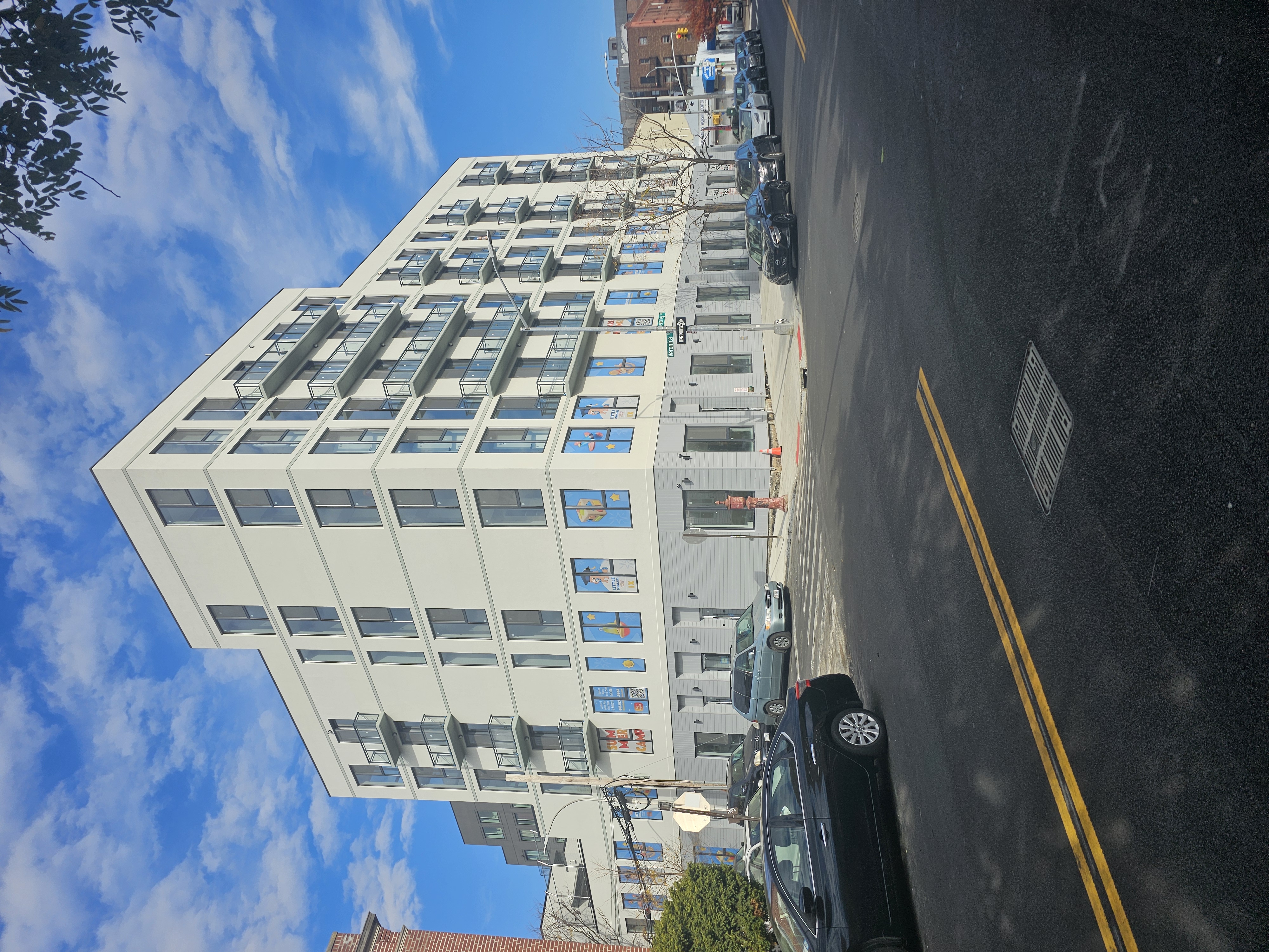 Mixed-use facade on Beverley Road, Brooklyn, with new apartment windows above a storefront