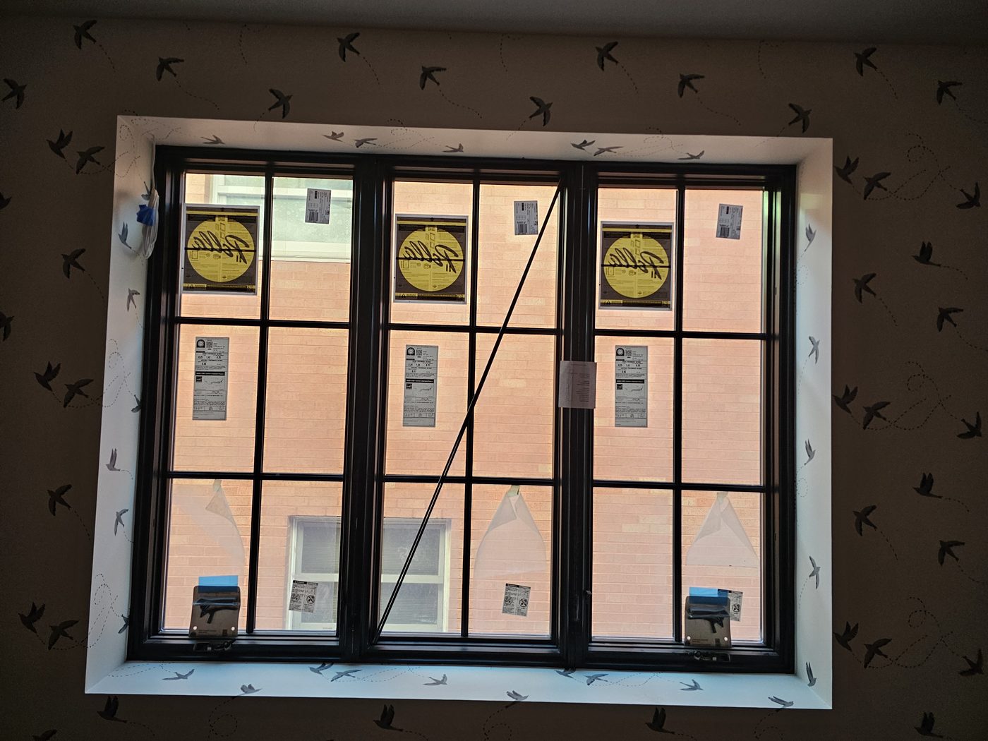 Triple Pella casement window with divided lites in a bedroom of the Manhattan Beach house