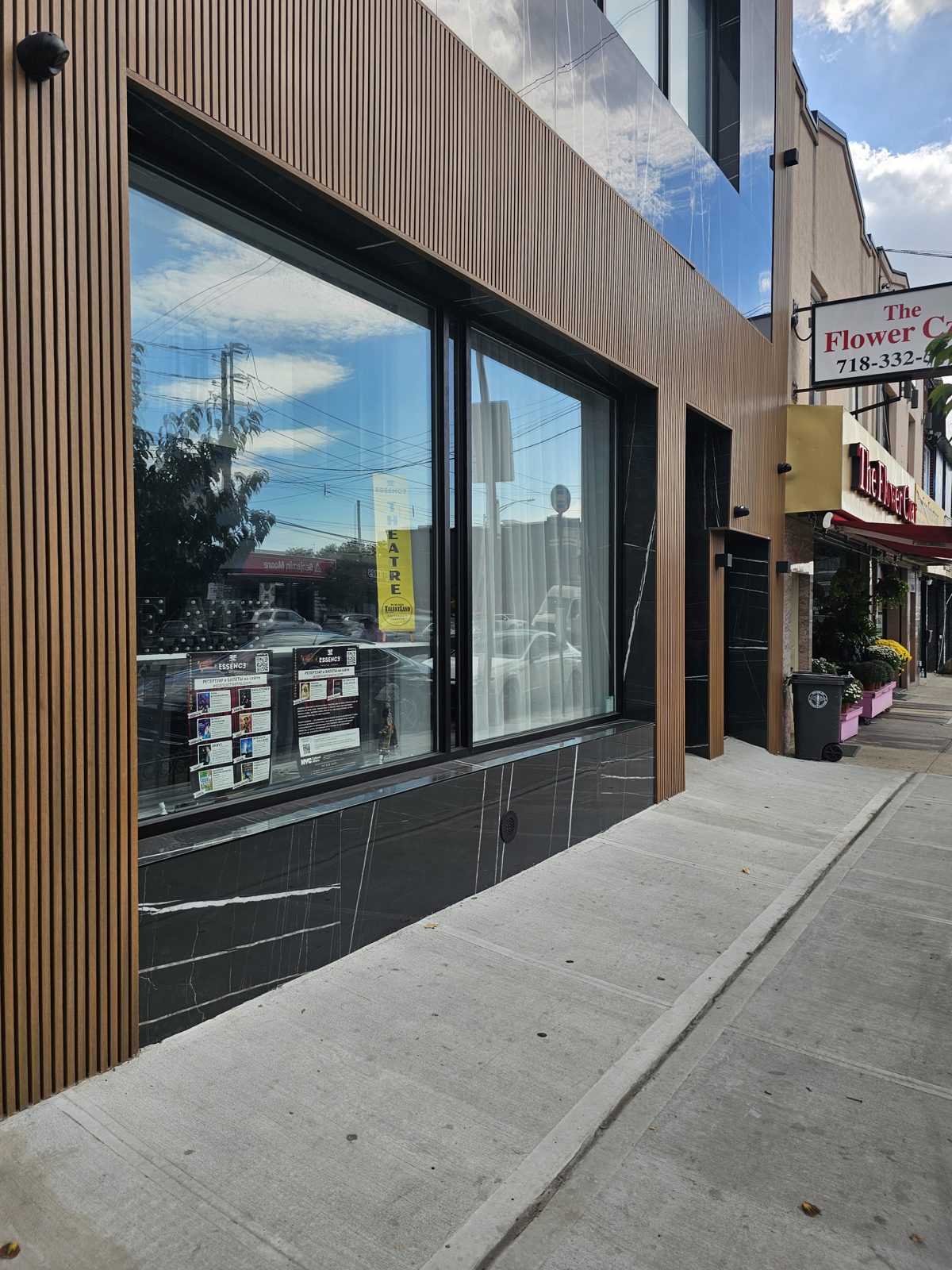 Oversize tempered insulated storefront glass with black frame and granite tile base, Coney Island Avenue Brooklyn