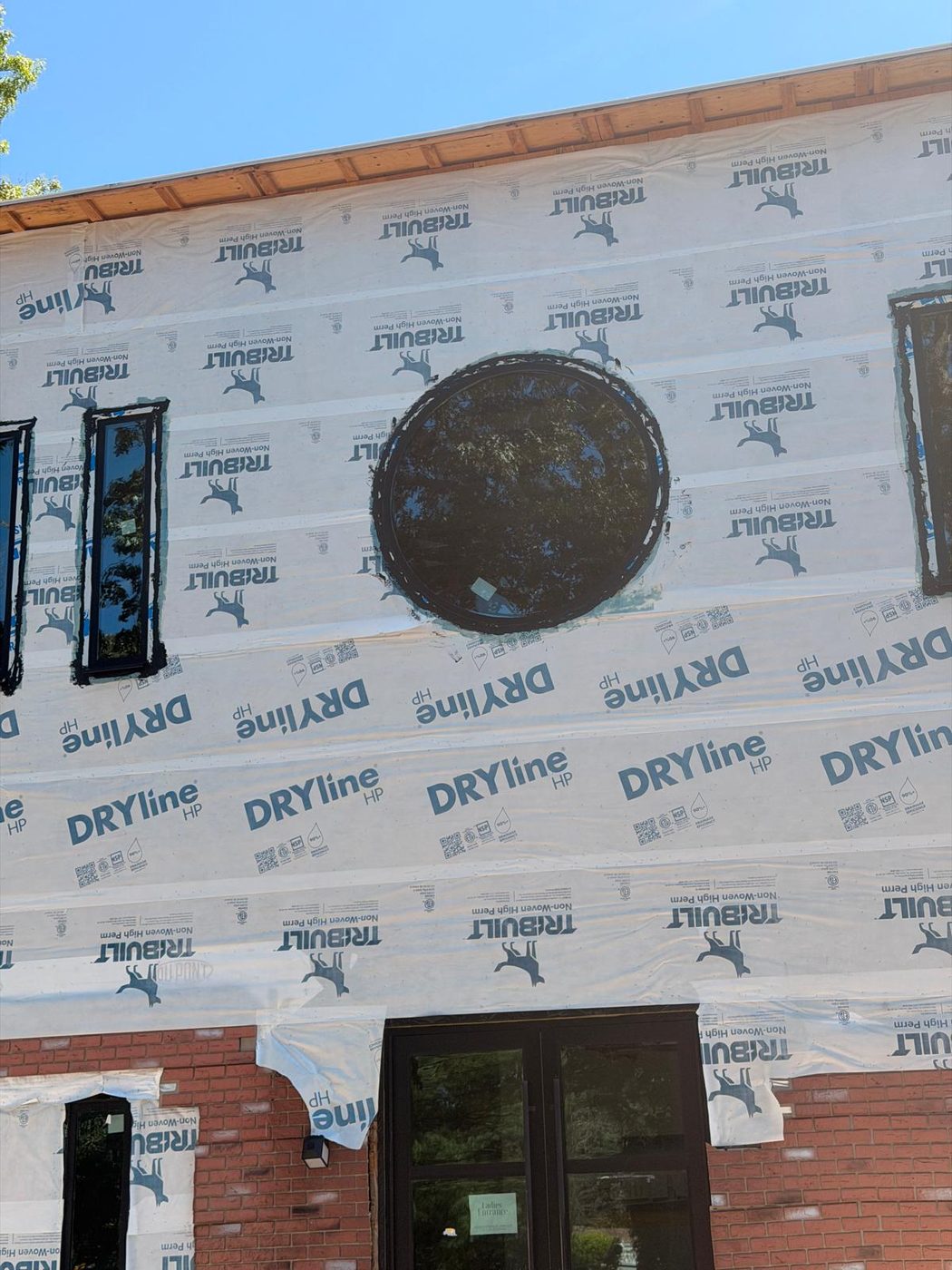 The six-foot diameter round window installed in the front facade, before cladding &mdash; Lakewood, New Jersey