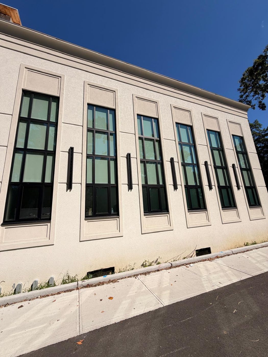 Completed facade with the repeating narrow window bays &mdash; Lakewood, New Jersey