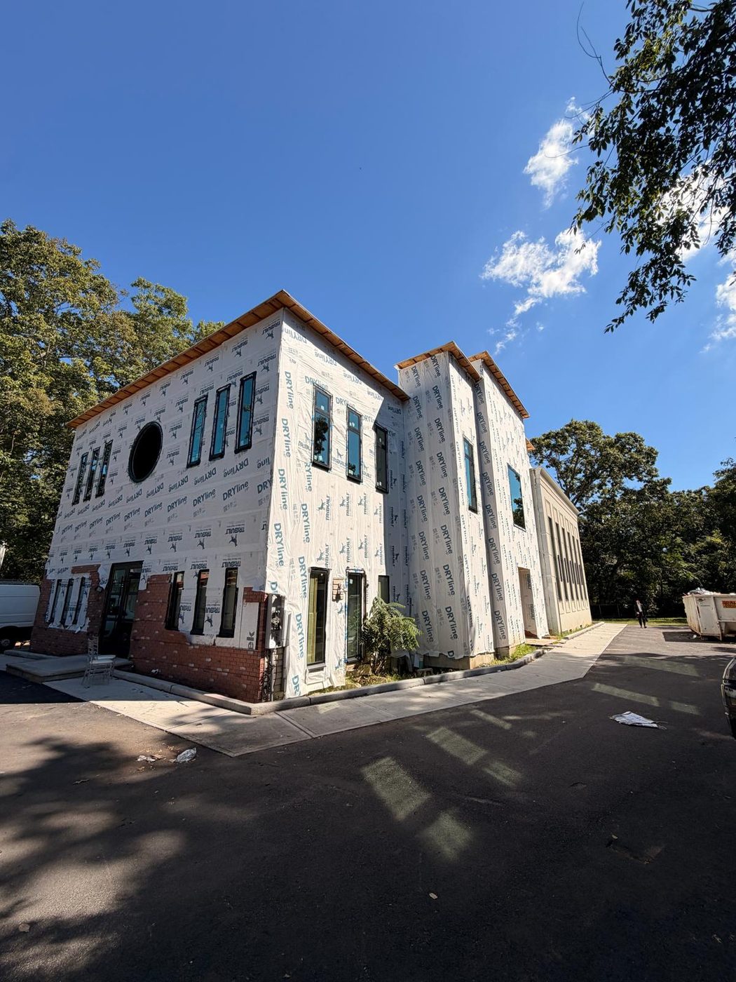 Corner elevation showing the window programme across two faces of the building &mdash; Lakewood, New Jersey