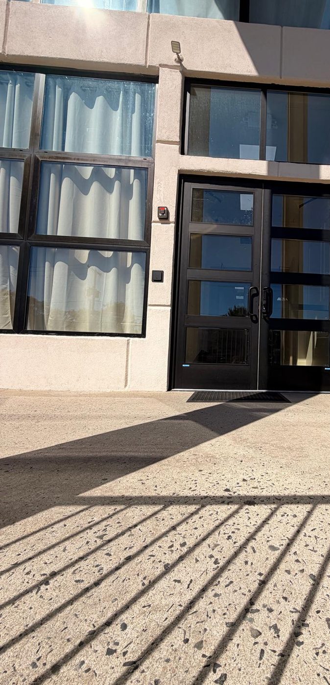 Commercial entrance doors with transom, in dark finish &mdash; Lakewood, New Jersey