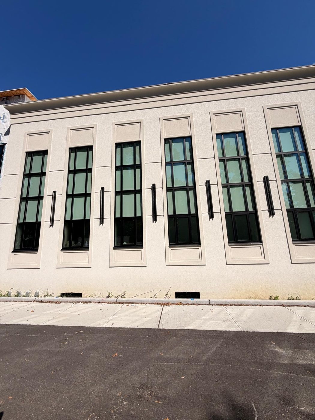 The narrow window bays at close range, showing sightlines and finish &mdash; Lakewood, New Jersey