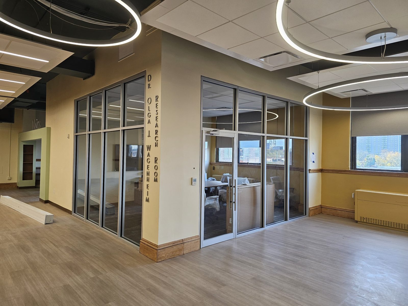 Aluminum-framed glass office partition and single glass door enclosing the Dr. Olga J. Wagenheim Research Room at the Newark Public Library main branch, 5 Washington Street, Newark NJ