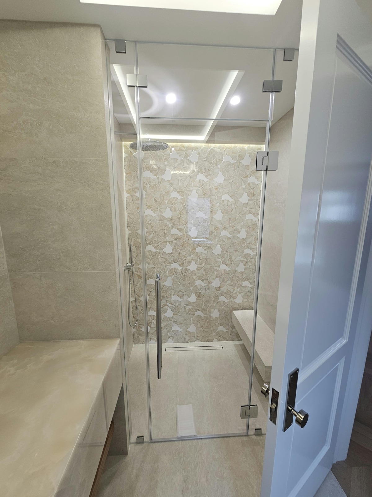 Shower with frameless Starphire glass door and cream tile, Ocean Avenue, Brooklyn