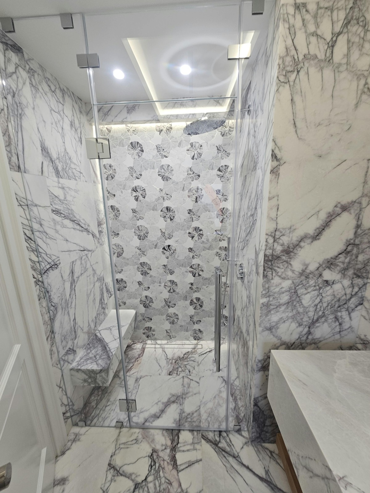 Marble bathroom with frameless Starphire glass shower enclosure, Ocean Avenue, Brooklyn
