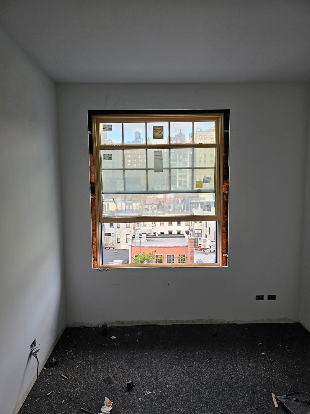 A Pella Reserve double-hung installed from inside, upper sash divided and lower sash a single lite &mdash; Upper West Side, Manhattan